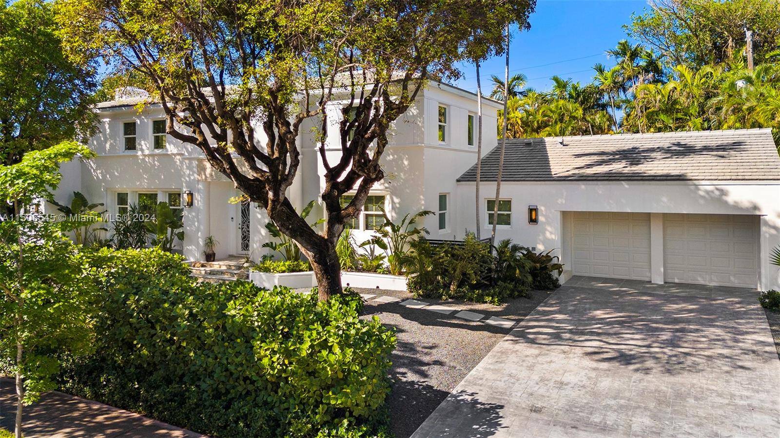 Walk to the ocean from this magnificent estate on tranquil Flamingo Drive.