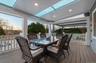 Wooden deck featuring outdoor dining area