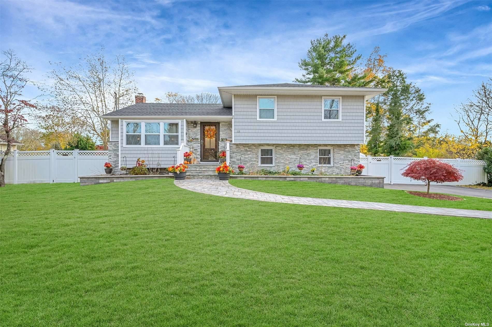 This meticulously kept split level home has it all !