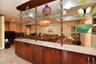 Kitchen featuring light stone countertops