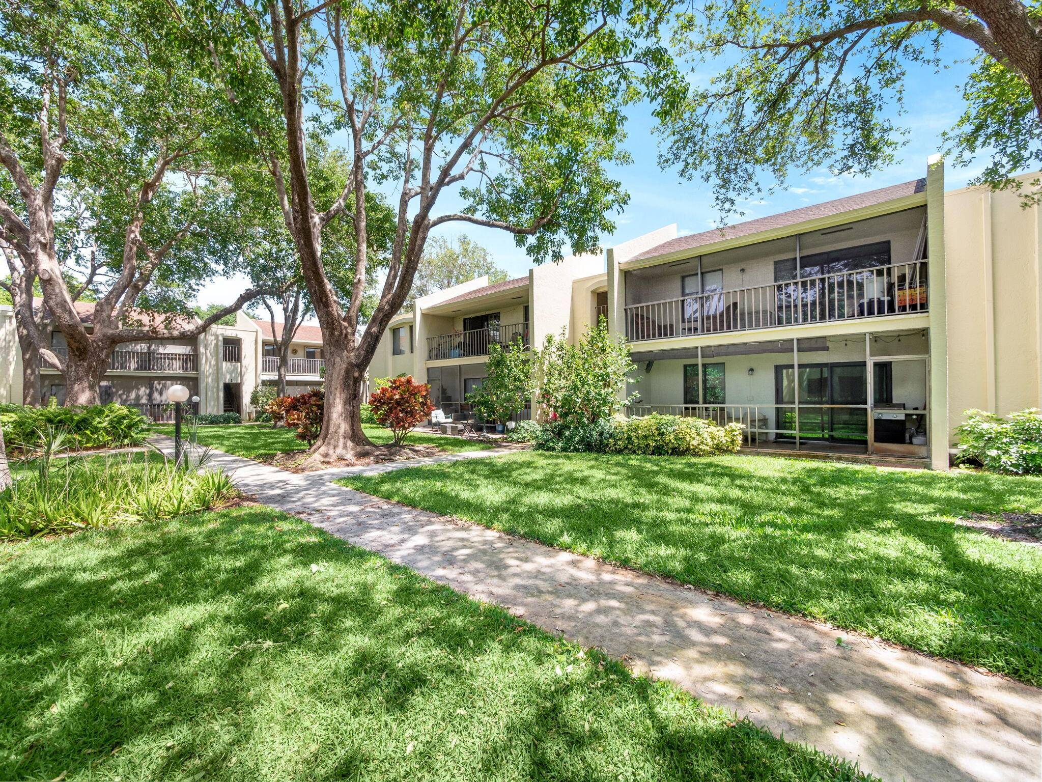Charming ground floor unit boasting freshly painted interiors and exteriors, enhanced with granite countertops and backsplash, stainless steel appliances, and tile flooring throughout the living areas complemented by vinyl flooring ...
