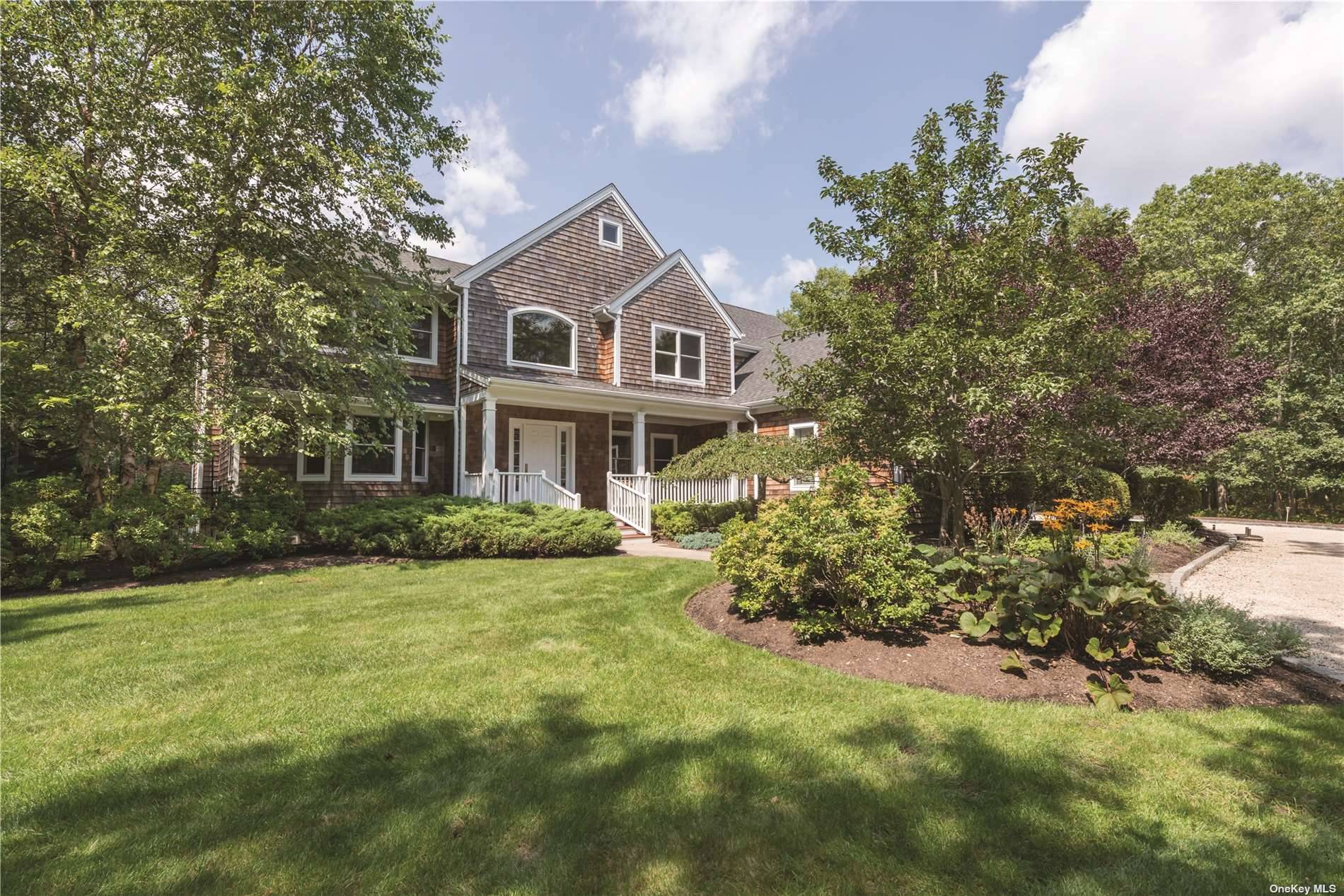 Located on a private 1. 2 acre in Quogue Village, this 4662 sq.