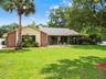 Charming Front Exterior with Expansive Lawn