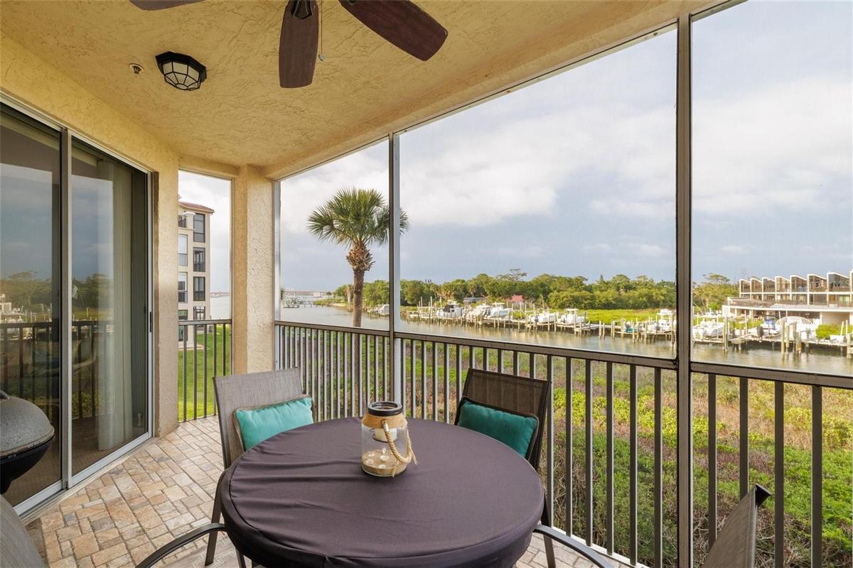 Screened balcony overlooks creek & river!