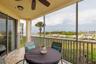 Screened balcony overlooks creek & river!