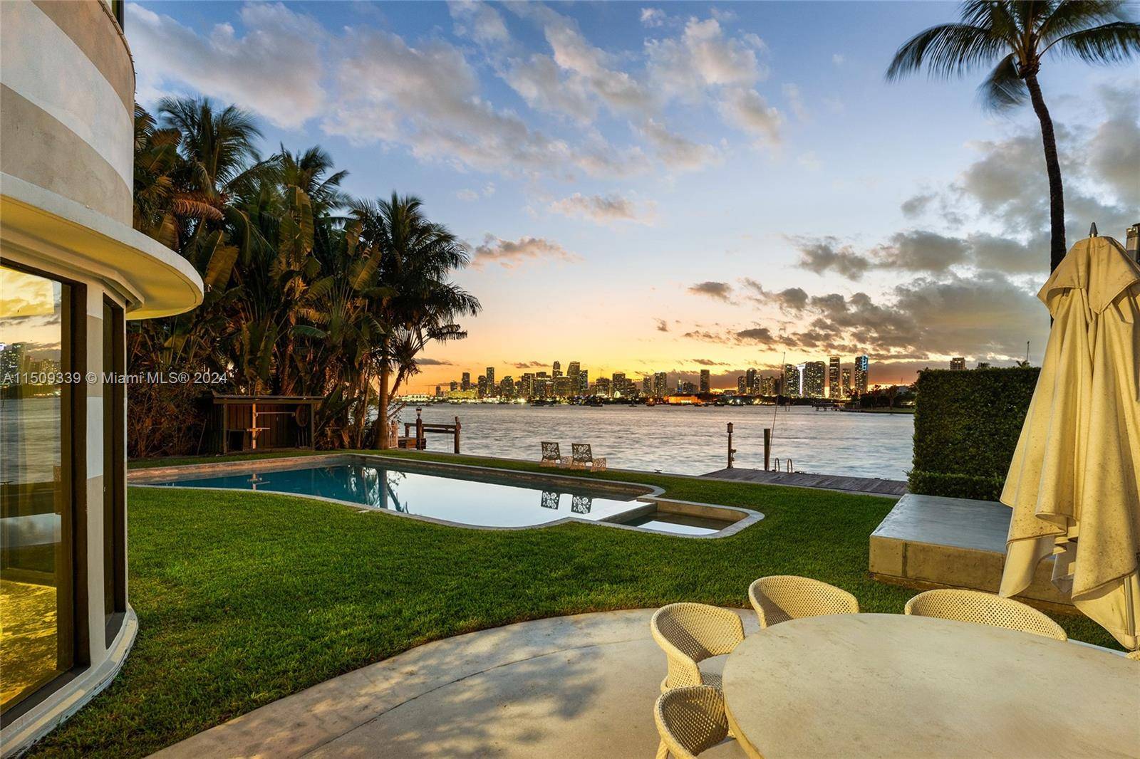 An amazing opportunity to develop a beautiful new estate with open Biscayne Bay downtown sunset views or renovate the existing 4BR 5 1 BA Art Deco bayfront home situated on ...