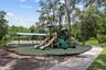 Community playground and shaded recreation area.