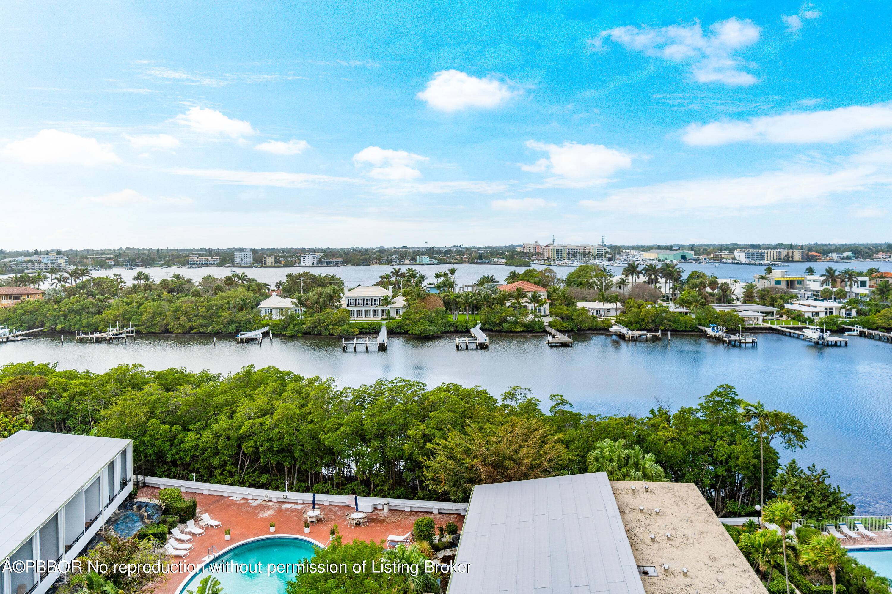 Indulge in the captivating Intracoastal vistas from every corner of this expansive two bedroom, two bathroom Mayfair Lake Penthouse.