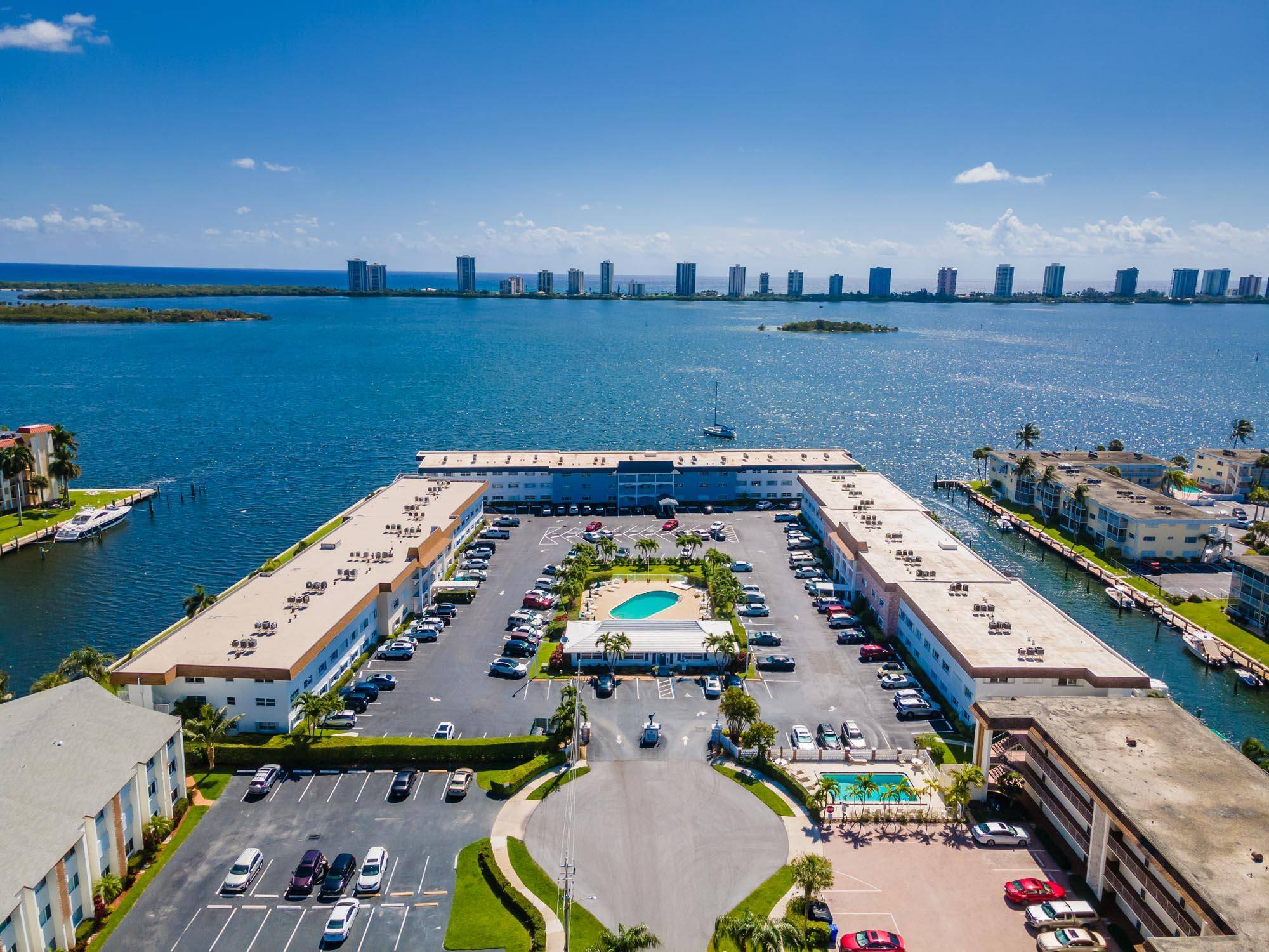 Indulge in the breathtaking waterviews from this captivating 2 bedroom, 2 bath condo nestled in the vibrant 55 community of Shore Club.