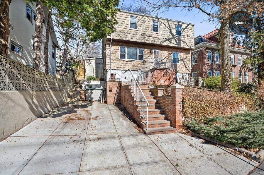 Stunning three family home on a tree lined street in North Riverdale.