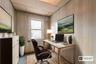 Office featuring wood walls and a paneled ceiling