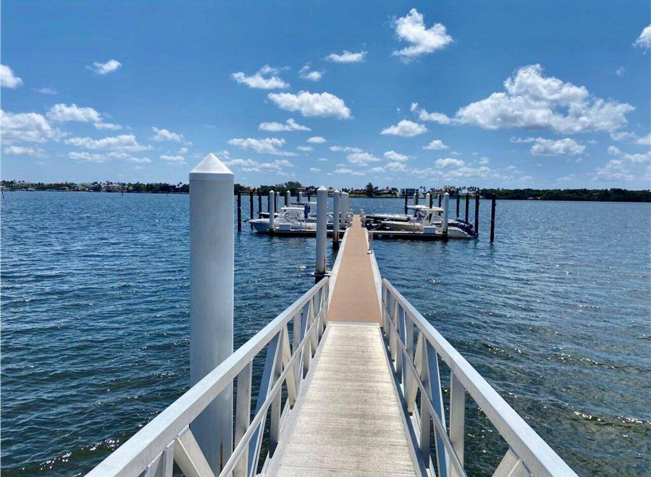 Step into the lap of luxury with this exquisite townhouse, offering direct water access and a plethora of recreational activities including boating, jet skiing, kayaking, fishing, and pristine white sandy ...