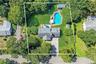 Aerial view of property's location featuring property boundaries highlighted and a pool