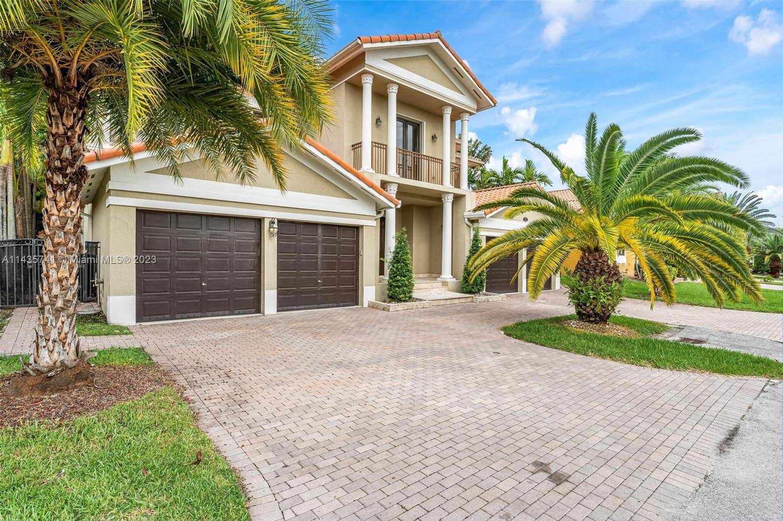 This beautiful two story home is located in the gated community of Cutler Cay.
