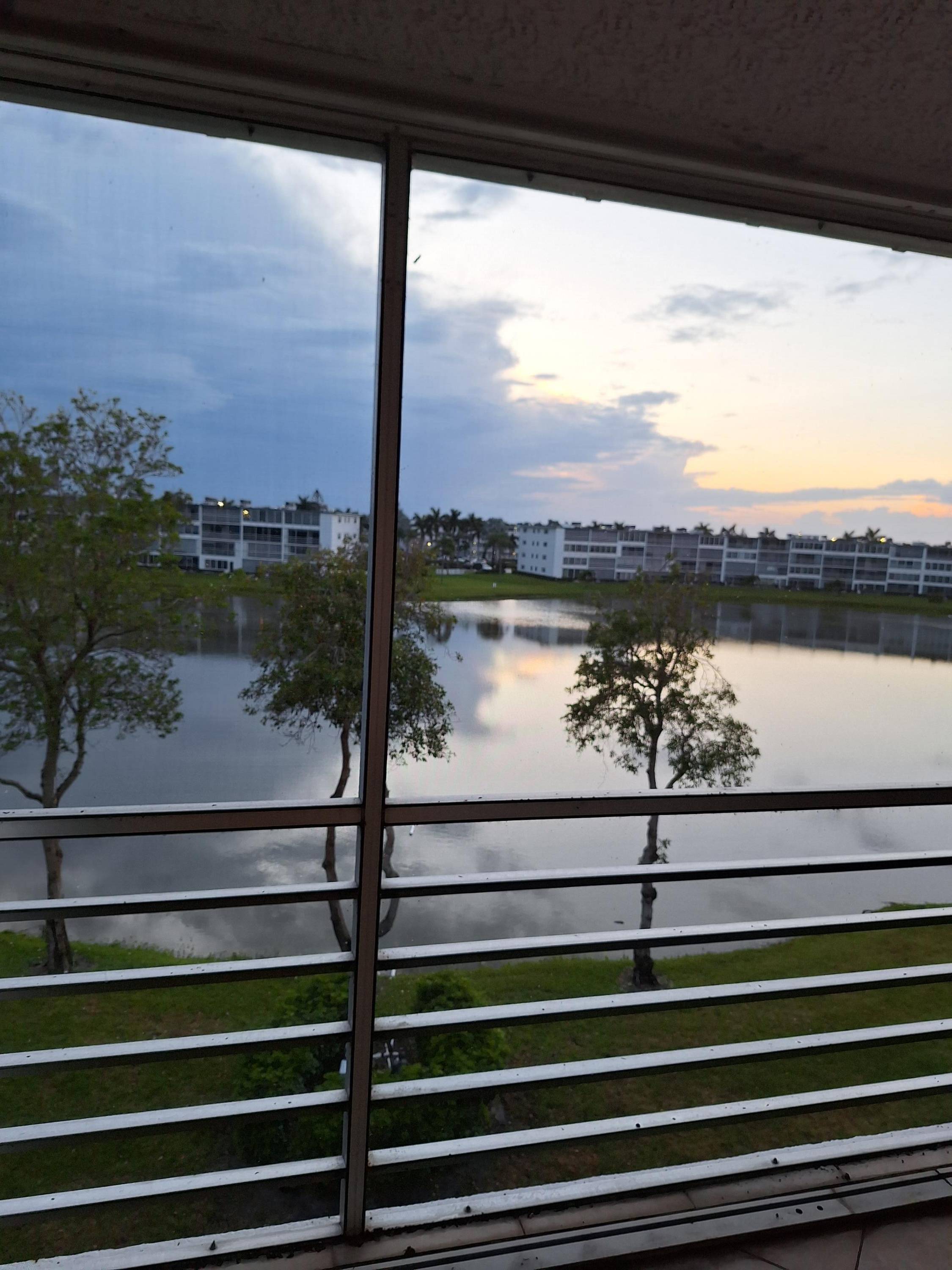 Century Village Boca Raton offers amazing lake views spacious outside patio, updated kitchen, tile throughout, this unit overlooks the endless lake view.