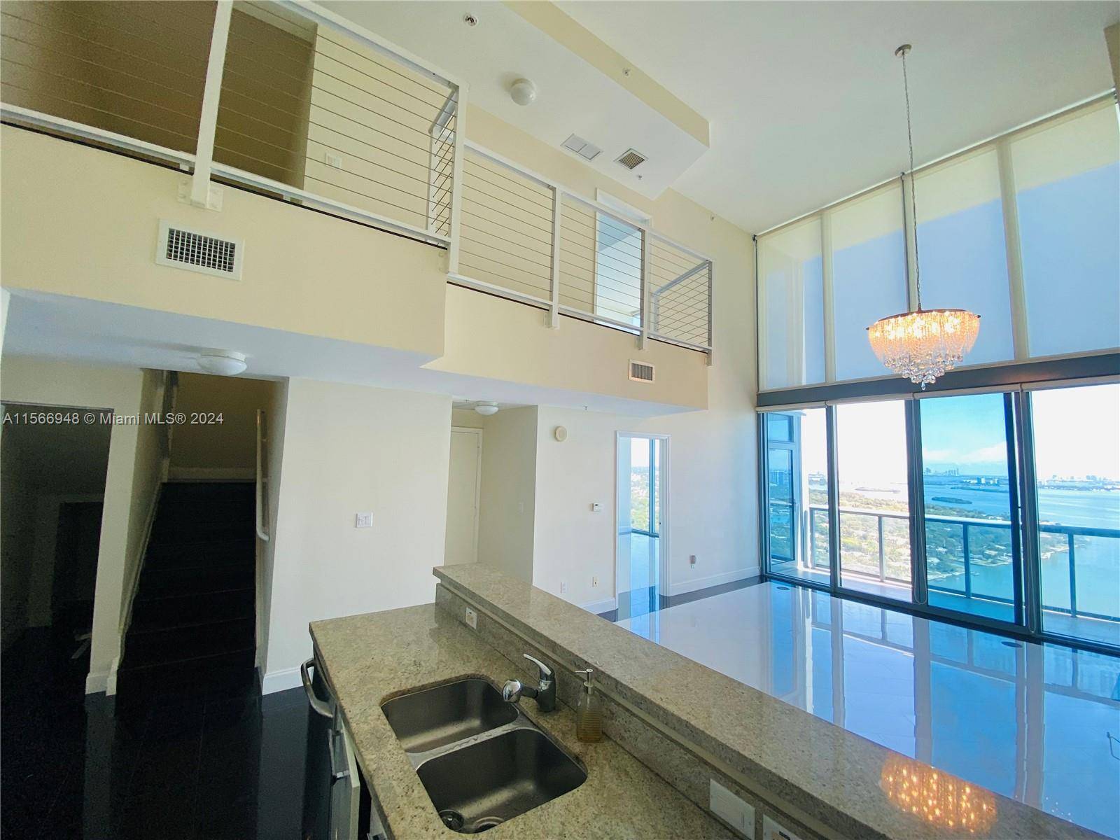LOCATION LUXURY ! Breathtaking two story Penthouse showcasing unparalleled waterfront views.