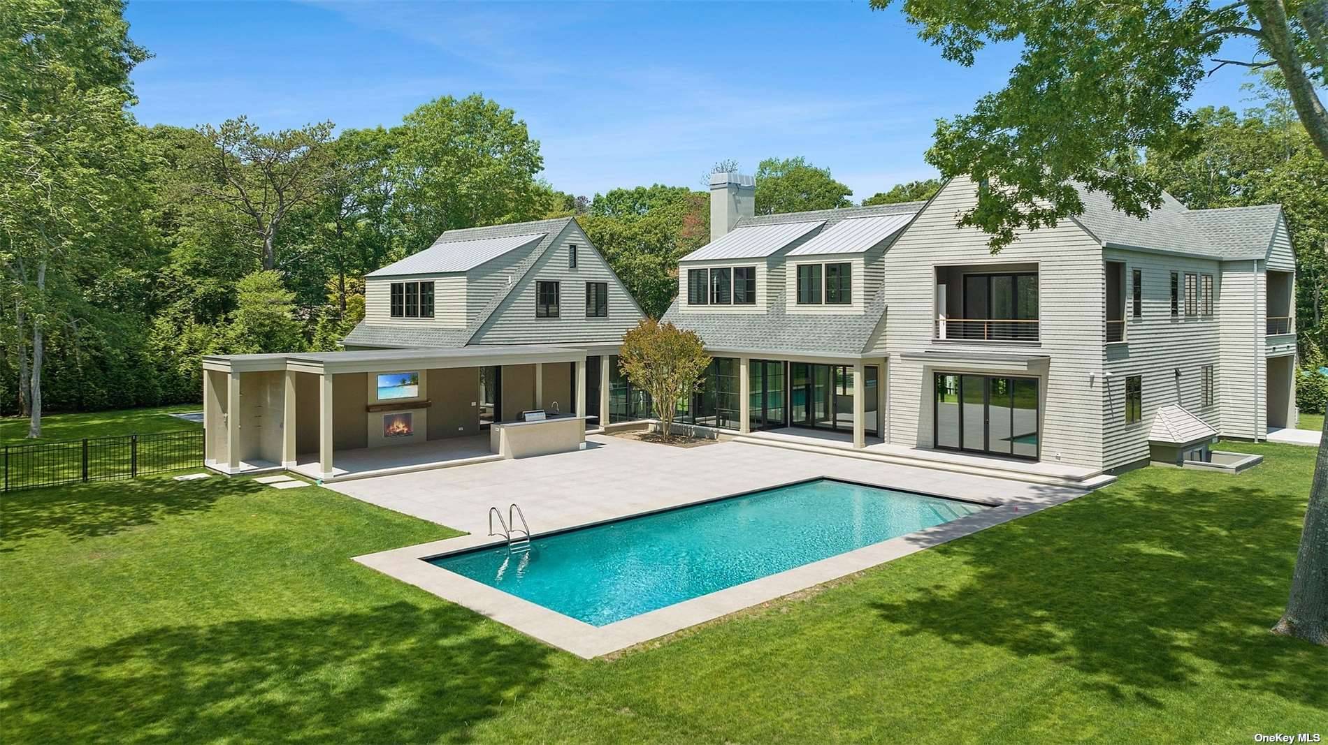 Welcome to this Quogue Village Stunner, a 5, 550 sq.