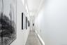 Hallway featuring concrete flooring