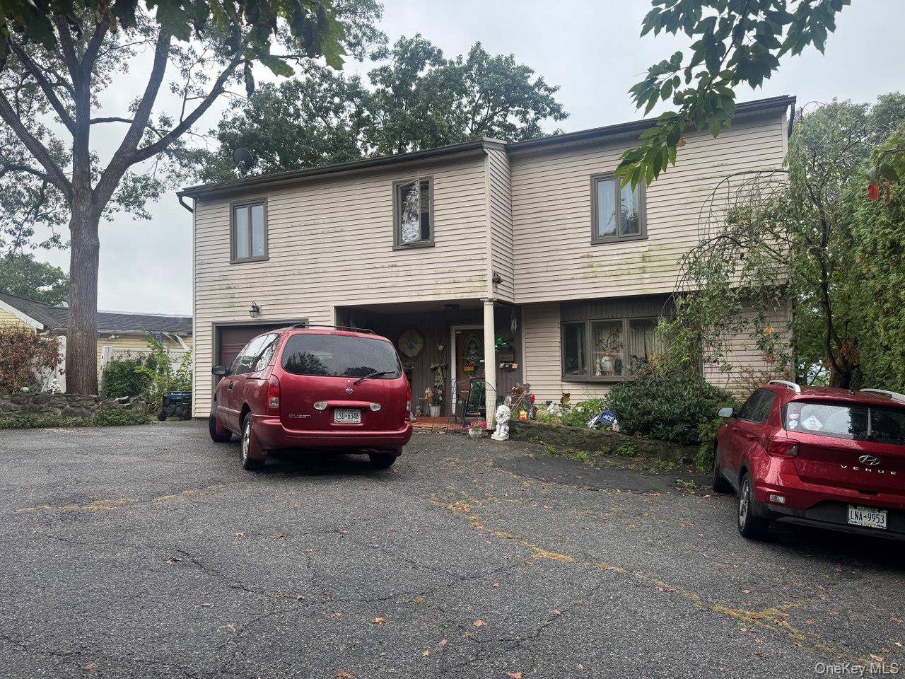 Discover this spacious single family home on a peaceful cul de sac in Yonkers, NY, offering an incredible opportunity to create your dream living space.