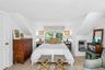 2nd floor Primary Bedroom featuring light wood-finish flooring, white walls, and a window with a roman shade