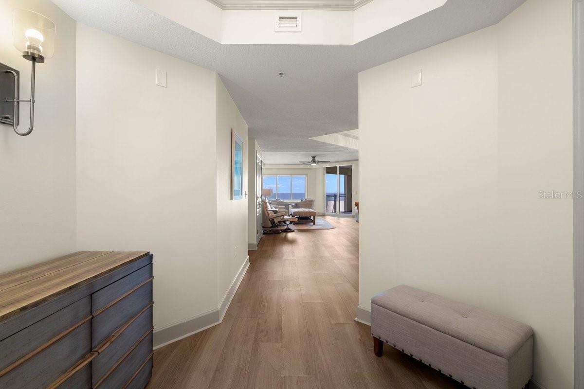 As the space opens before you, your eyes are naturally drawn beyond the living areas to the stunning ocean views waiting in the distance.