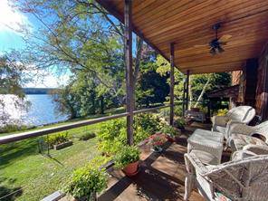 Rare Mid Century Lakeville Lake Unparalleled western water views and the surrounding hills from nearly every room in this mid century shingle masterpiece.