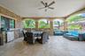 View of patio / terrace with an outdoor kitchen, an outdoor hangout area, outdoor dining area, and ceiling fan