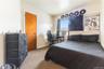 Bedroom with carpet flooring and baseboards