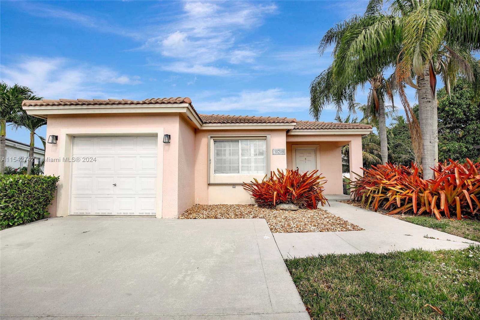 A true gem nestled in the desired gated community of Avalon in Miramar, positioned on a cul de sac lot with a gorgeous lake view seen upon entry.