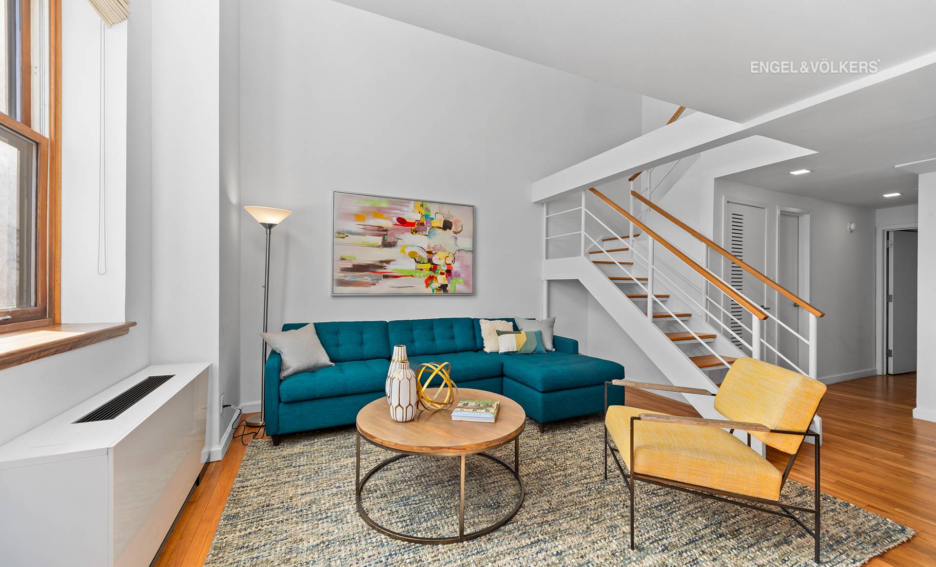 DRAMATIC 2 BEDROOM DUPLEX CONDO SOARING 16 FOOT CEILINGS DOUBLE EXPOSURE Be WOWED by Apartment 721, a fabulous home in the iconic Rutherford Place Condominium in the Gramercy area.