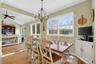 Dining room with light wood-type flooring, a chandelier, and recessed lighting
