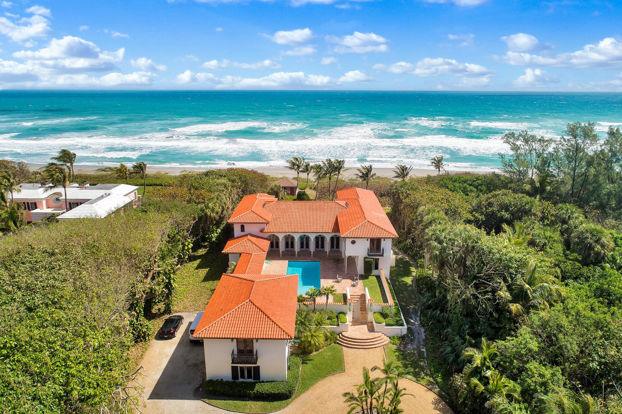 This spacious direct oceanfront home features spectacular ocean views, secluded private beach, freshly painted and updated house with 4 bedroom suites in the main house and a 2 bedroom guesthouse, ...