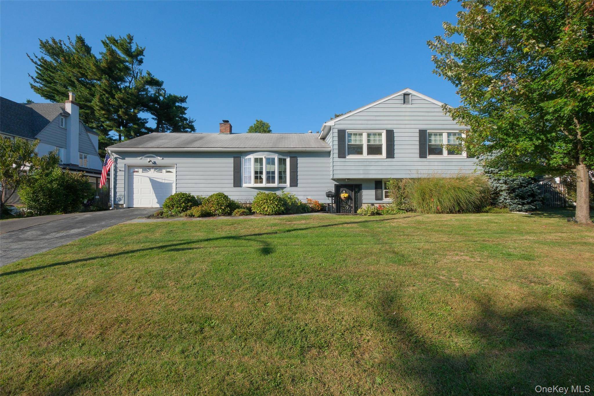 Set on the crest of Elm Street in the Mortgage Hill area of Peekskill, this well maintained custom built split level home offers warmth, space and modern comforts.