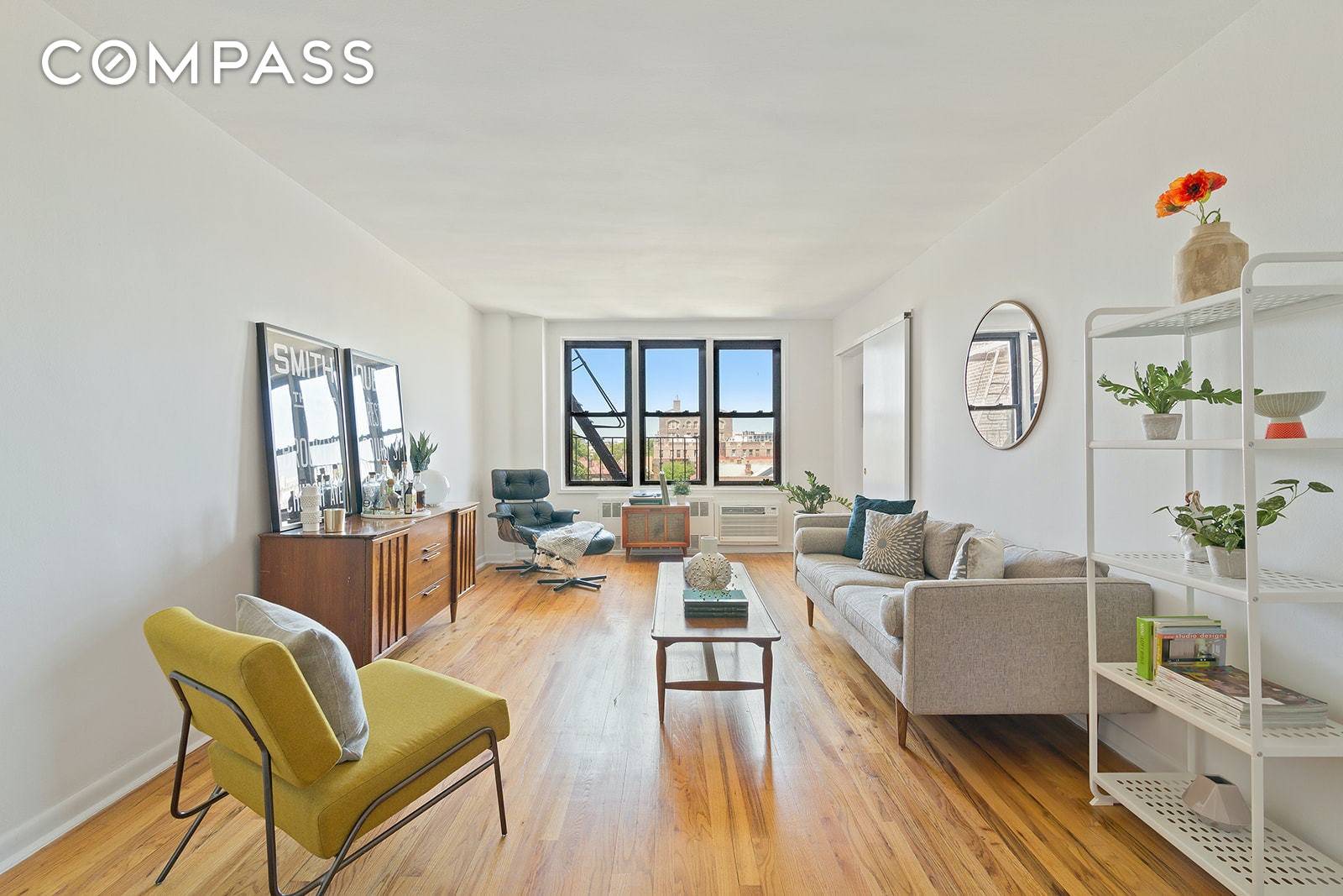 Perched high above the trees, with the most magnificent light streaming through, is unit 5J in 350 Ocean Parkway.