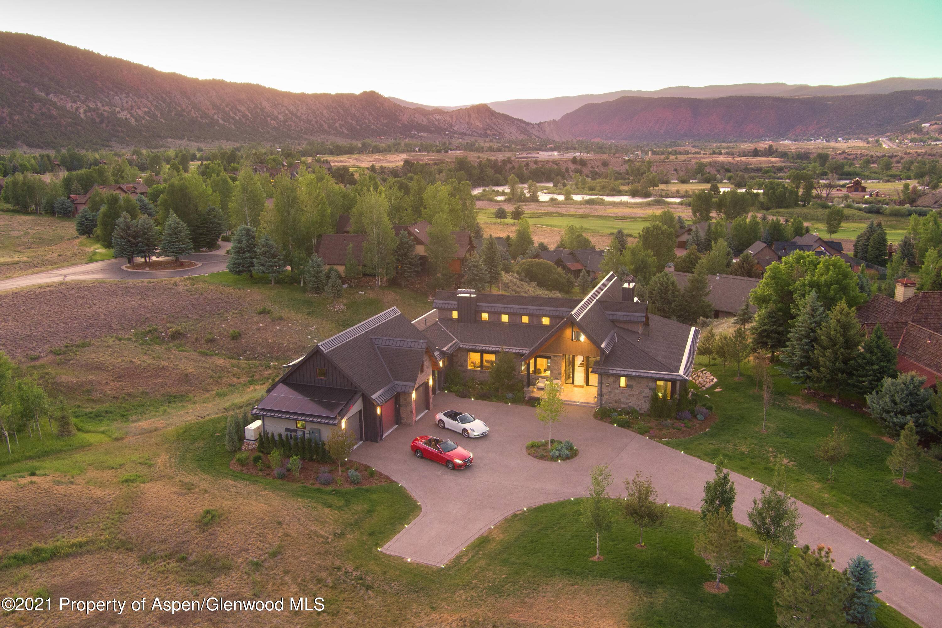 Welcome to a custom rustic contemporary estate in the gated community of Aspen Glen.