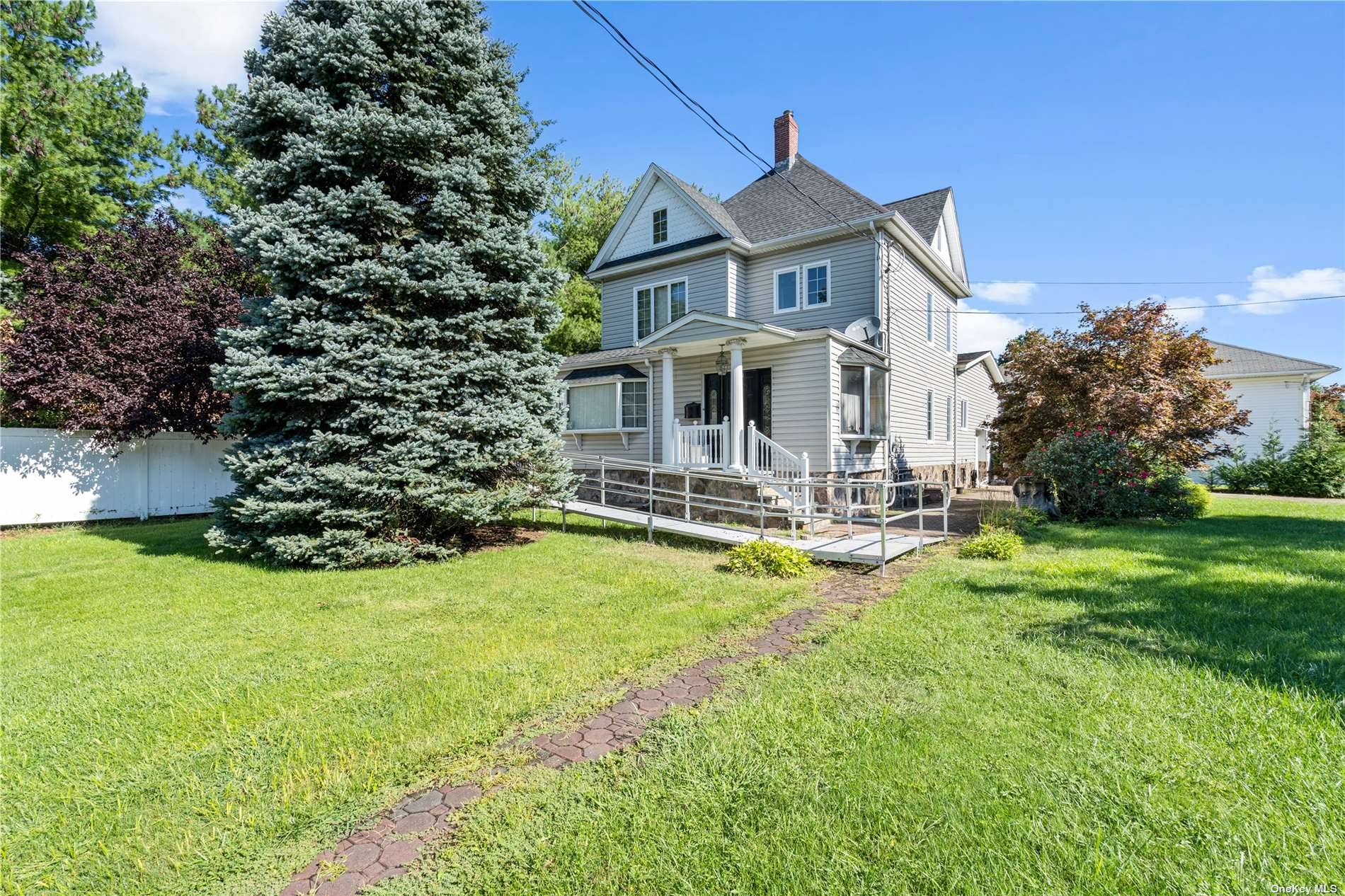 Charming Colonial house is situated on an oversized corner lot, providing ample space and privacy, in the heart of Rockville Centre.