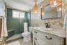 It features a well-appointed renovated guest bathroom with a gorgeous tile shower!