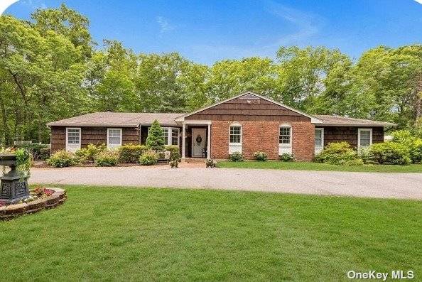 Discover this stunning, expansive home nestled on a secluded, lush one acre property within the renowned Blue Ribbon award winning Commack school district.