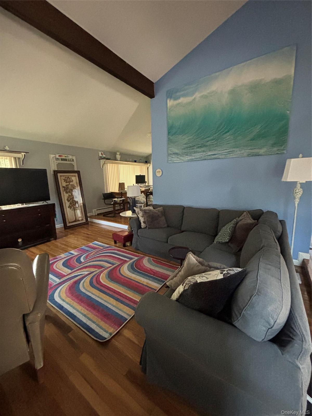 Sunken In Living Room with a Sectional couch, Recliner, Smart TV.