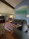 Sunken In Living Room with a Sectional couch, Recliner, Smart TV.