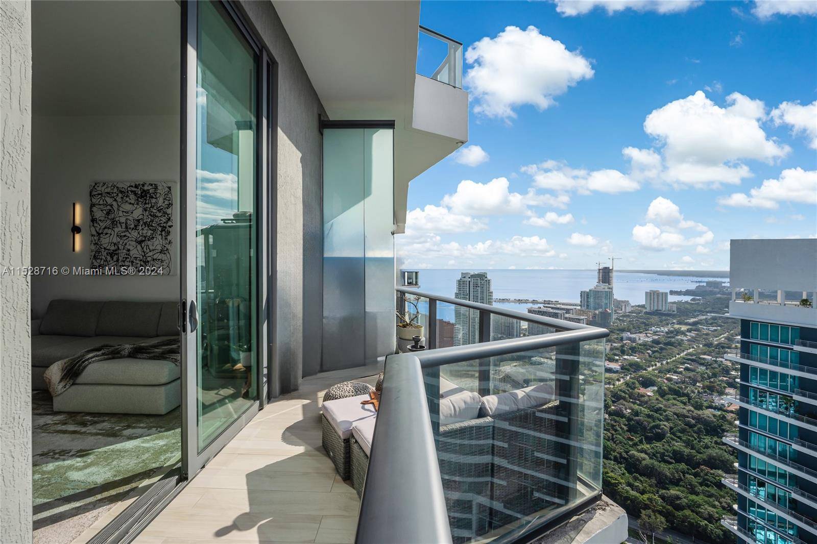 Welcome to a one of a kind access to Upper Penthouse level with 12 ft ceilings.