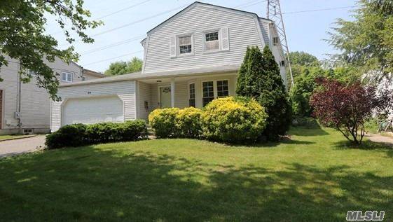Welcome to this spacious Colonial conveniently located in Albertson Downs.
