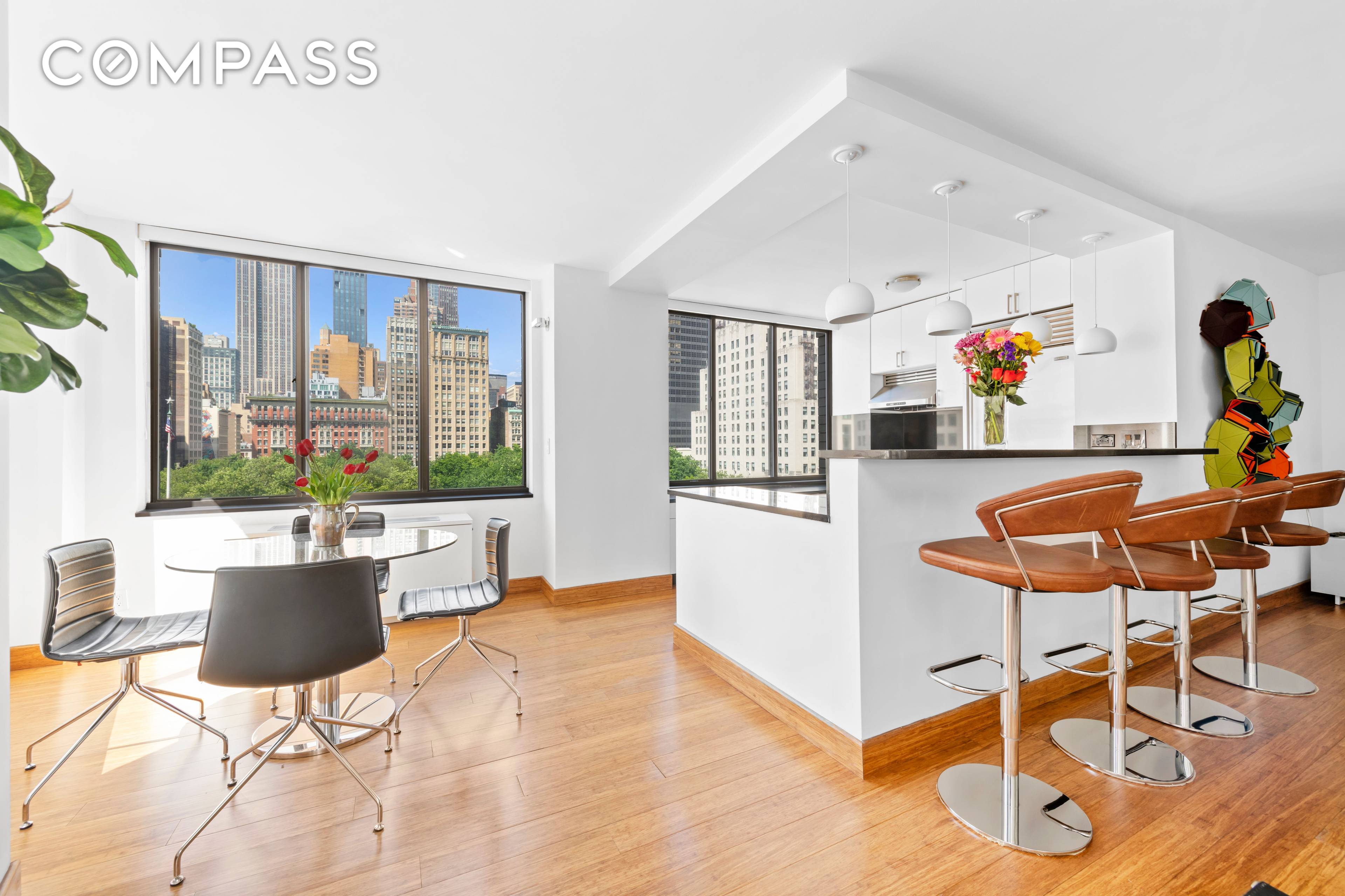 Make mesmerizing skyline and park views your daily backdrop in this pristine two bedroom, two bathroom corner residence with private outdoor space at the Flatiron District's revered Madison Green condominium.