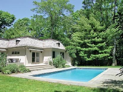 PRIVACY AWAITS YOU IN THIS EAST HAMPTON FRENCH STYLE HOME