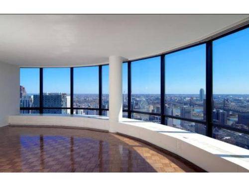 Prime UES Location * Curved Wall of Windows and Spacious Layout * Dining Alcove * High Ceilings