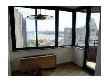 MAGICAL PANORAMIC VIEWS OF THE EAST RIVER TWO BEDROOM ONE AND A HALF BATHROOM CONDO WITH A BALCONY